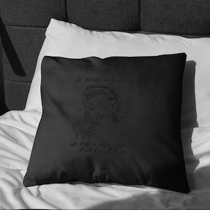 May include: Black decorative pillow with a retro-style illustration of a woman holding a coffee cup. The pillow features the text "Of course size matters" and "NO ONE WANTS A SMALL CUP OF COFFEE".