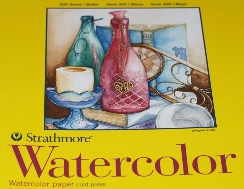 Peut inclure: Une peinture &agrave; l'aquarelle d'une nature morte repr&eacute;sentant une bougie, une bouteille avec un charme en forme de c&oelig;ur et une horloge. La peinture est sur du papier &agrave; aquarelle Strathmore &agrave; pressage &agrave; froid.