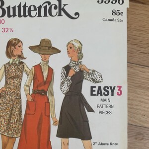 May include: Vintage sewing pattern for a dress with three different styles. The pattern is from Butterick and is number 5996. The pattern is for size 10 and bust 32 1/2 inches. The pattern is called "Easy 3" and has three main pattern pieces. The dress styles are mid-knee, midi, and 2 inches above the knee.