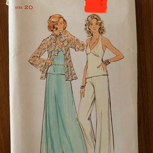 May include: Vintage sewing pattern for a two-piece outfit. The pattern is for size 20 and features a long, flowing skirt and a halter top. The pattern is from the "Button" brand, "The Fashion One".