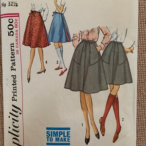 May include: A vintage sewing pattern for a wrap skirt. The pattern is for a junior size with a waist measurement of 23 1/2 inches and a hip measurement of 32 1/2 inches. The pattern is from Simplicity and is printed on a white background with black text. The pattern shows three different styles of skirts, all with a wrap design. The skirts are shown on three different models, each wearing a different color skirt. The pattern is labeled "Simplicity Printed Pattern 50c" and "Simple to Make".