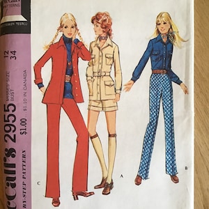 May include: A vintage sewing pattern for misses' coordinated separates. The pattern includes three different looks: a red jacket and pants, a beige safari-style shirt and shorts, and a blue shirt and pants. The pattern is McCall's 2955 and is size 12-34.