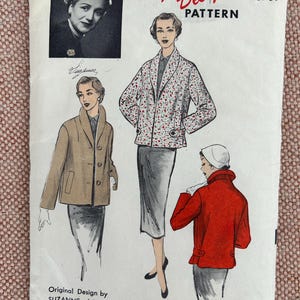 May include: A vintage sewing pattern for a jacket, featuring a woman wearing a red and white patterned jacket. The pattern is from the New York Times Designer Series and is for size 16, bust 34.