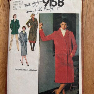 May include: Vintage Simplicity pattern 9158, featuring illustrations of coats and a woman in a red coat. The pattern includes two sizes, 6 & 8, and the text "Tops, pants and skirt not included".