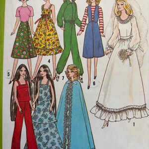 May include: A sewing pattern illustration featuring eight outfits for dolls, including a white wedding gown with a veil, a blue cape, a red jumpsuit, a floral tiered dress, a green jumpsuit, a blue vest dress, a yellow floral dress, and a skirt.