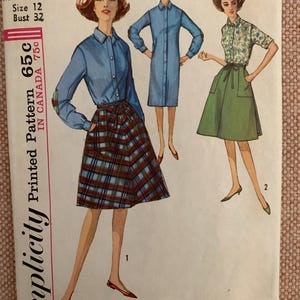 May include: Vintage Simplicity sewing pattern 5385 for a dress with a plaid skirt and a blue shirt. The pattern is for size 12 with a bust measurement of 32 inches.