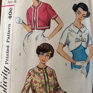 May include: Vintage Simplicity sewing pattern featuring illustrations of women's jackets. The pattern includes a pink jacket with white trim, a white jacket with a bow, and a floral jacket. The pattern size is Miss 16, Bust 36.