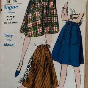 May include: Vintage Vogue pattern 5730 showing illustrations of three skirts. The skirts are in different colours and patterns, including plaid and solid blue. The pattern includes the text "Easy to Make". Waist sizes 26 and 36.