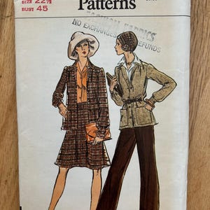 May include: Vogue Patterns sewing pattern featuring illustrations of two women in vintage fashion. The pattern includes a skirt suit and a pantsuit. The cover displays the number 8772, size 22 1/2, and bust 45.