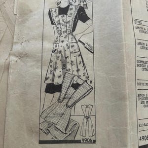 May include: Vintage sewing pattern featuring an illustration of a woman wearing an apron with a bow pattern. The pattern includes diagrams and instructions for making the apron. The number 4906 is visible.