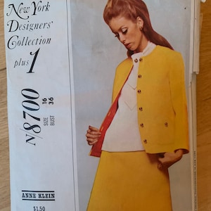 May include: Vintage sewing pattern for a women's suit by Anne Klein. The pattern cover features a photo of a woman wearing a yellow skirt suit with a white blouse. The pattern is from the New York Designers' Collection, size 16, bust 36.