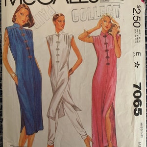 May include: McCall's pattern 7065 for a sleeveless dress with a mandarin collar and side slits. The pattern is for a miss size medium and includes three different dress styles: a blue dress, a white dress, and a pink dress.