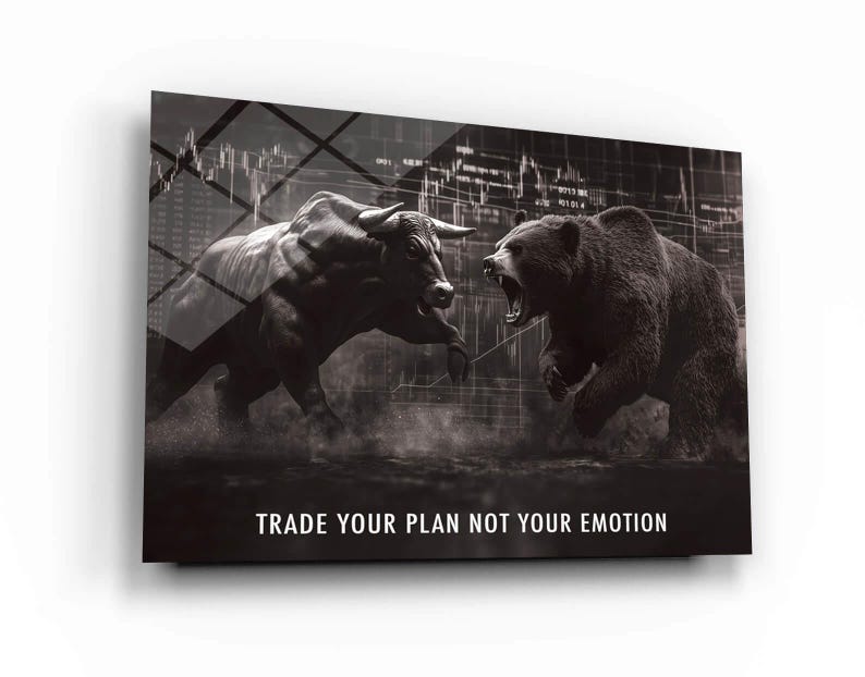 May include: Monochrome artwork showing a bull and a bear in a confrontational pose, with financial data in the background. The text "TRADE YOUR PLAN NOT YOUR EMOTION" is displayed at the bottom. The image is mounted on a white surface.