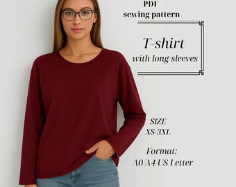 May include: A burgundy long-sleeve T-shirt. The shirt is a solid color with a crew neck. The image also includes text that reads "PDF sewing pattern", "T-shirt with long sleeves", "SIZE XS-3XL", and "Format: A0/A4/US Letter".