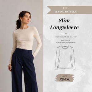 May include: A PDF sewing pattern for a slim long-sleeve top. The graphic displays the text Slim Longsleeve, For Height: 168 cm/5'6", Easy to sew step-by-step instructions, and Size XS-3XL. A line drawing of the top is included on the right side.
