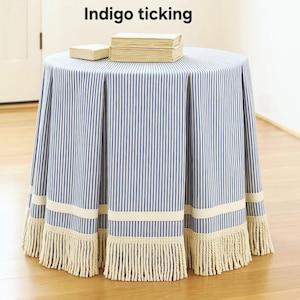 Ticking stripe tableskirt with grosgrain and bullion fringe trim pleated round or rectangular skirt , skirted table