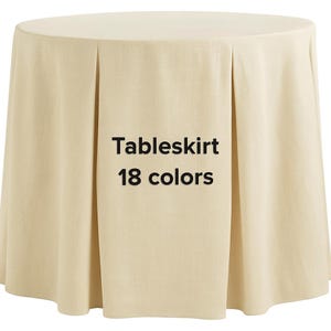 May include: A cream-colored tableskirt with a pleated design. The text "Tableskirt 18 colors" is displayed in black. The tableskirt is made of a textured fabric and is draped over a round table.