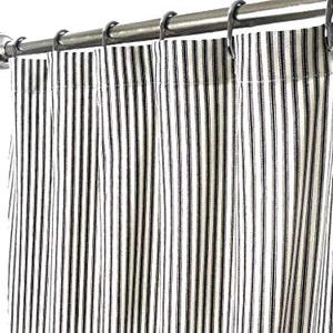 May include: Black and white striped shower curtain with a simple design. The curtain is hung on a silver rod.