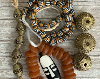 African bead design set, lost wax Brass, braided leather, Buddha scroll keeper, brass textured rings, bone mask pendants,fast pics fast ship