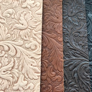 May include: Close-up of three fabric swatches with an embossed floral pattern. The swatches are in shades of beige, brown, and black.
