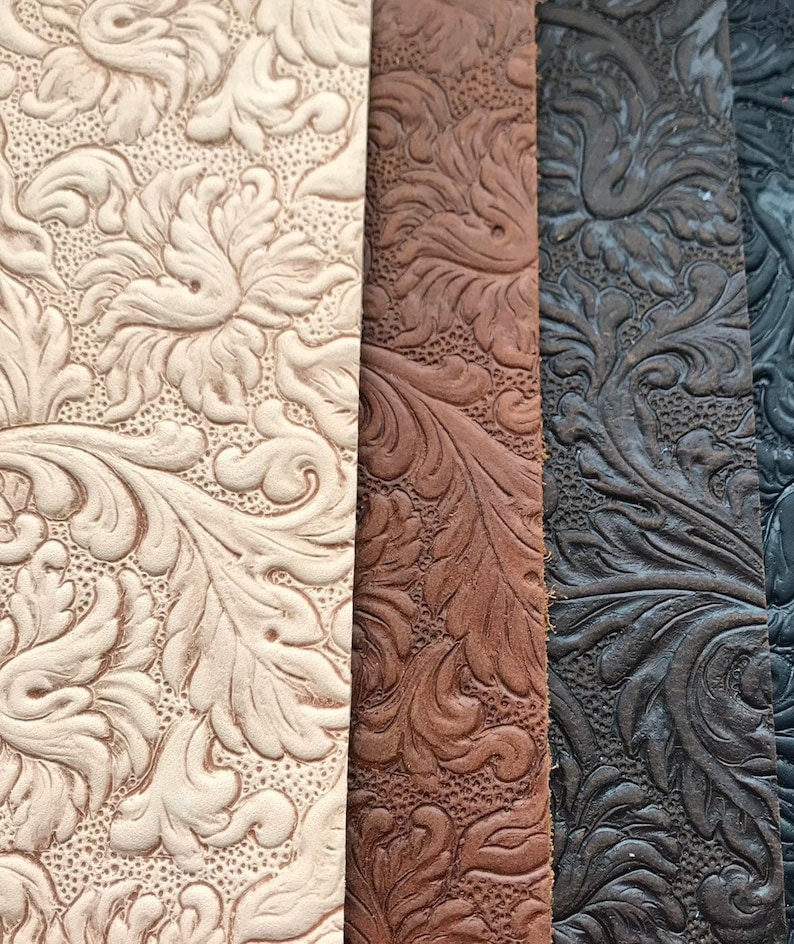 May include: Close-up of three fabric swatches with an embossed floral pattern. The swatches are in shades of beige, brown, and black.