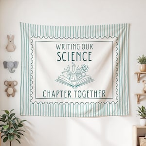 May include: A rectangular wall tapestry featuring a light blue and white vertical striped border. The centre displays a stamp-like frame with the text "WRITING OUR SCIENCE CHAPTER TOGETHER" and an illustration of an open book with science equipment.