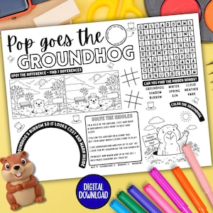 May include: Groundhog Day activity sheet in black and white, featuring a word search, spot the difference game, and riddles. Includes a cartoon groundhog illustration and the text "Pop goes the Groundhog". Markers and pencils are visible.
