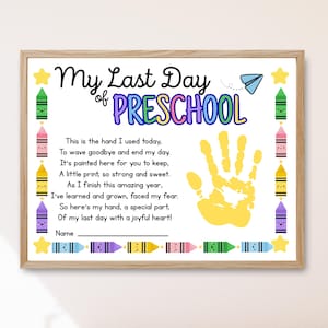 May include: A framed print titled "My Last Day of Preschool." The design features colorful crayons, stars, and a yellow handprint. The text includes a poem about the end of the school year and a space for a name.