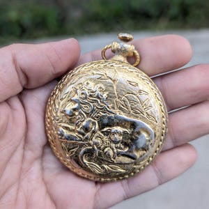 Vintage Pocket Watch style Max Factor Pressed Powder Compact-Lion and Lamp design