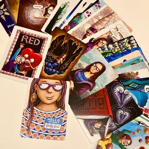 May include: A set of colorful playing cards with illustrations of various characters and scenes. The cards feature a variety of colors, including red, blue, green, and yellow. The cards are arranged in a fan shape, with the top card showing a woman with a red heart. The text on the cards includes "Red", "Treasure", "Hello My Name Is Geeky Girl", "Precious", "Elephant", "Book", and "On".