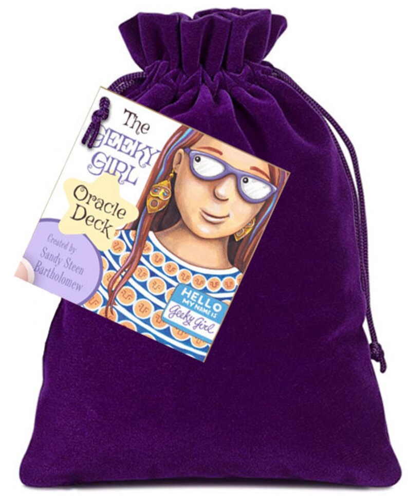 May include: A purple velvet bag with a drawstring closure. The bag contains a deck of oracle cards with the title "The Geeky Girl Oracle Deck" and an illustration of a girl with glasses and a name tag that reads "Hello, my name is Geeky Girl".