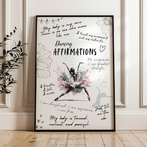 May include: Black framed art print featuring a watercolor ballerina with pink and blue paint splashes. The print includes the words "Dancing Affirmations" and inspirational phrases like "My body is my voice" and "I am free."
