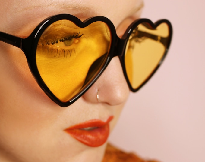 Goldie 70's 90's Retro oversized yellow heart shaped sunglasses with black frames
