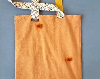 Handmade tote bag using upcycled burnt orange natural fabric