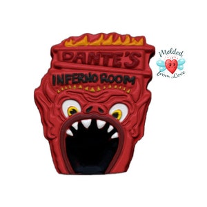 May include: Red and black 3D printed sign with the text "Dante's Inferno Room" and a cartoon devil face with a large open mouth.