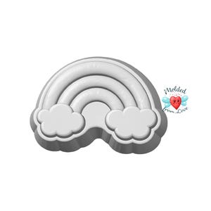 May include: A gray plastic rainbow cookie cutter with two white clouds at the bottom. The rainbow has three curved bands. The text "Molded from Love" is in the upper right corner.
