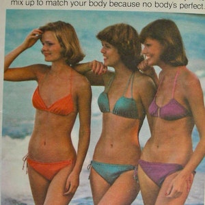 May include: A vintage sewing pattern for a string bikini swimsuit. The pattern is called "The String" and features three women wearing different styles of string bikinis. The pattern is for one size only and is sized for moderate stretch knits.