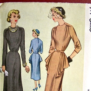 May include: Vintage McCall's sewing pattern for a women's dress. The pattern is for size 16, bust 34, and costs 50 cents. The pattern shows two different styles of dresses, one with a fitted bodice and a full skirt, and the other with a more fitted skirt. The pattern is printed on a light pink background.