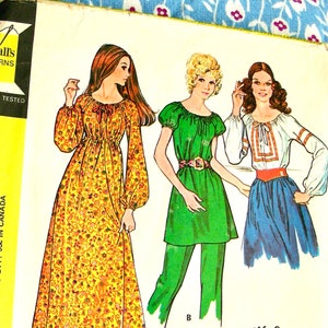 May include: A vintage sewing pattern featuring three women's clothing designs. The first design is a long, yellow dress with floral print. The second design is a green tunic with a belt. The third design is a white blouse with a red sash. The pattern is titled "McCall's 2991" and is labelled "Misses' Dress, Tunic or Blouse".