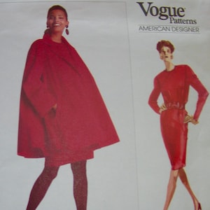May include: Vogue Patterns sewing pattern featuring designs by Geoffrey Beene. The cover shows illustrations of two red outfits: a flowing cape and a fitted dress. The text includes "American Designer" and pattern details.