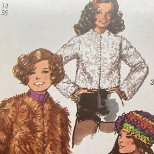 May include: A sewing pattern illustration featuring three jacket styles: a long-haired brown faux fur coat, a white textured jacket with long sleeves, and a brown coat with white trim and colorful decorative stitching, worn with a multi-colored knit hat.