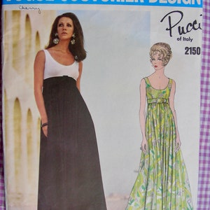 May include: A vintage sewing pattern featuring two women wearing long maxi dresses. The pattern is for a Pucci design, number 2150, and is titled "Vogue Couturier Design".