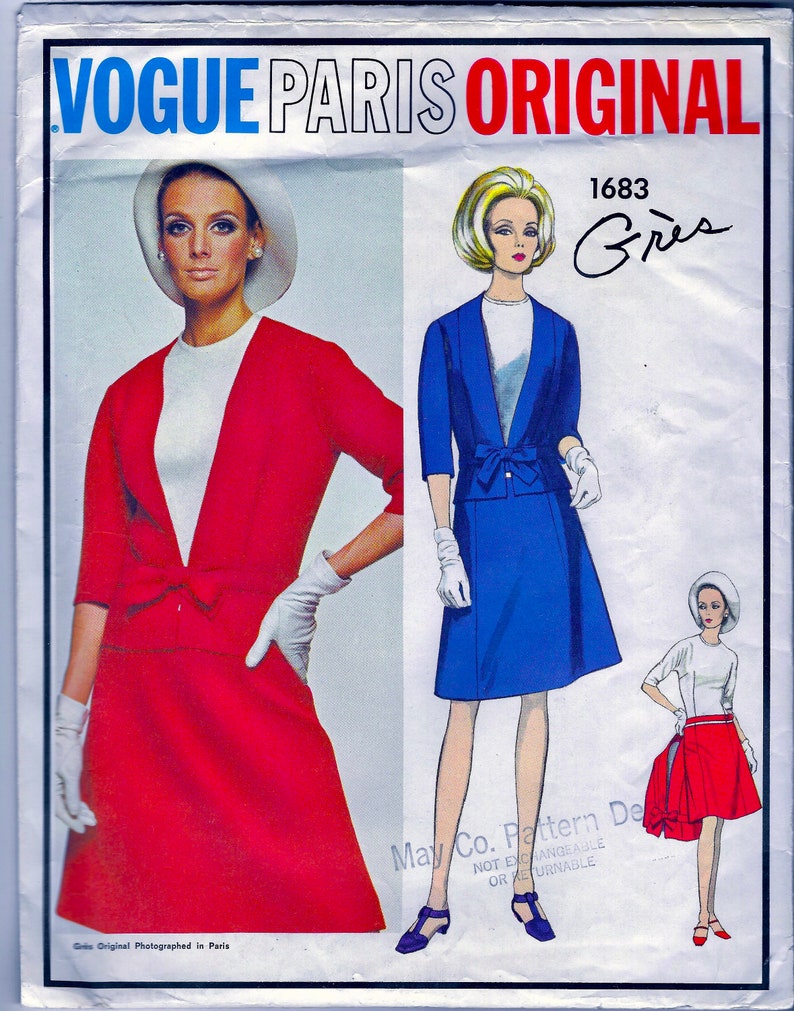 May include: A vintage sewing pattern featuring two women's outfits. The first outfit is a red dress with a white collar and a matching jacket. The second outfit is a blue skirt suit with a white blouse. The pattern is labeled "Vogue Paris Original 1683 Gr&egrave;s".