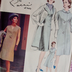 May include: A vintage sewing pattern by Pucci of Italy, pattern number 1299, featuring three women wearing different styles of dresses. The pattern includes a long coat with a collar and a short dress with a collar.