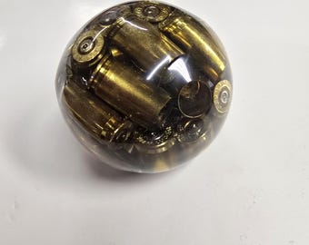 Resin bullet sphere - A beautifully handcrafted paperweight filled with spent bullet casings.  A bit over 2" (55mm).