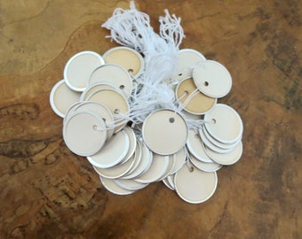 50 Vintage round white 1 1/4" paper tags with metal rims naturally age discolored