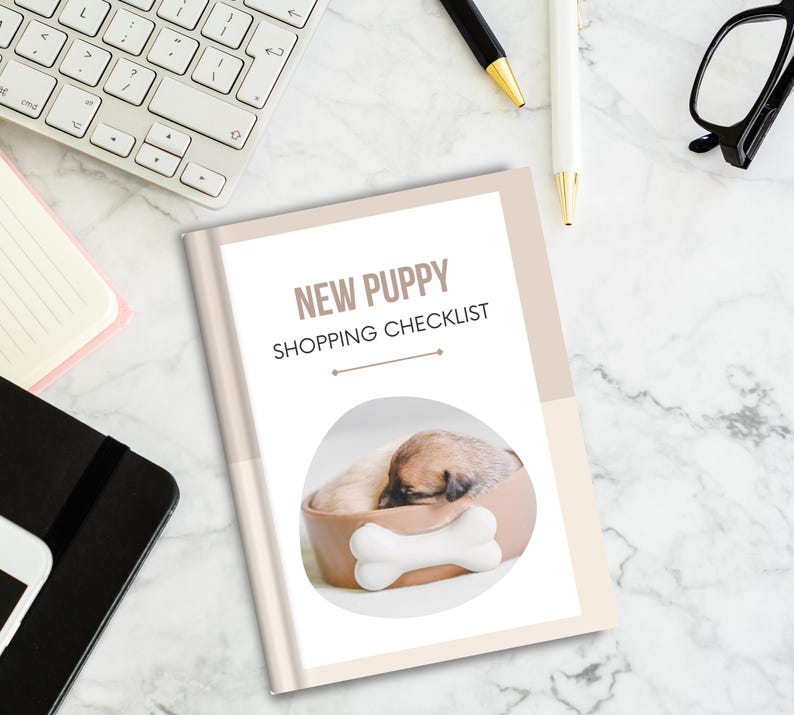 May include: A beige and white checklist titled "New Puppy Shopping Checklist" with a photo of a small puppy sleeping in a brown dog bed with a white bone.