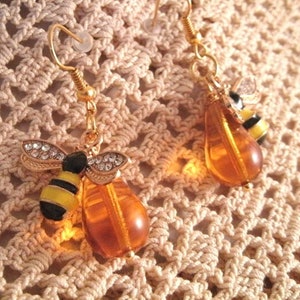 Rhinestone Bee charmer Earrings with Honey colored  tear drop glass beads Enamel painted Bees on 18k gold plated wires