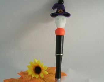 Stylos phosphorescents squelette avec chapeaux de sorcière violets