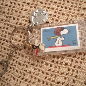 Flying Ace Vintage New snoopy stamp  unused vintage Stamp Key Chain clip with beagle charm and I love you to the moon and back charm
